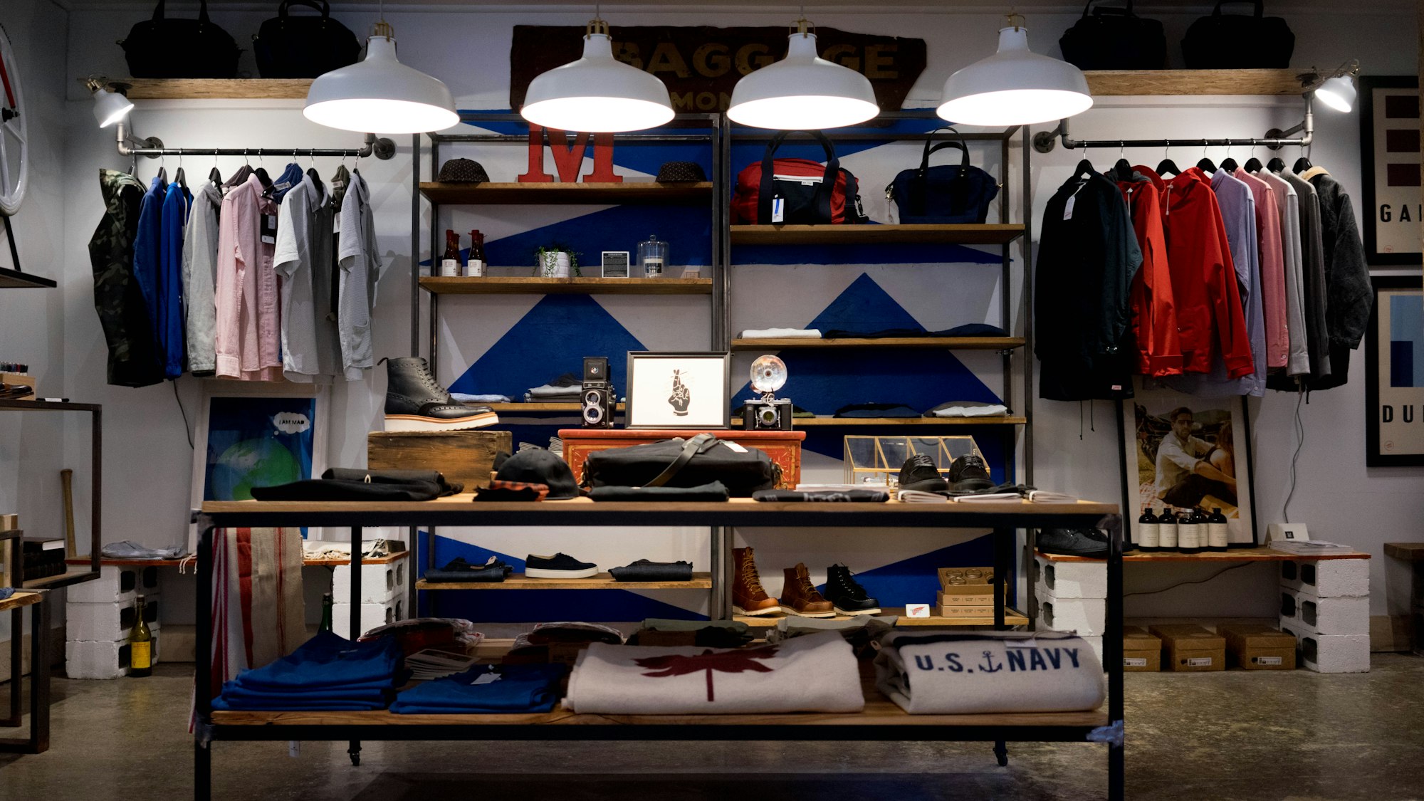 A quiet retail interior with pale timber and concrete
